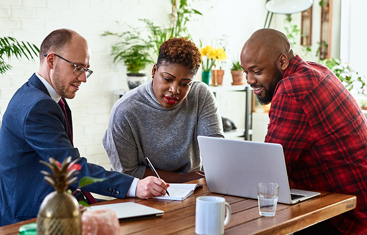 A couple talking with an investment professional